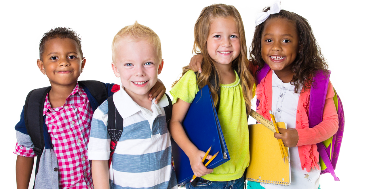 Group of young schoolchildren wearing backpacks