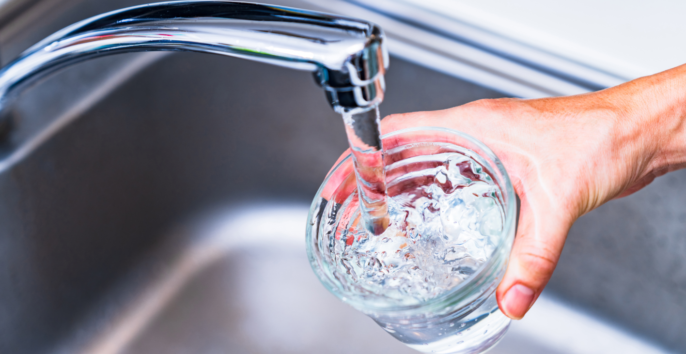 Tap water filling a glass
