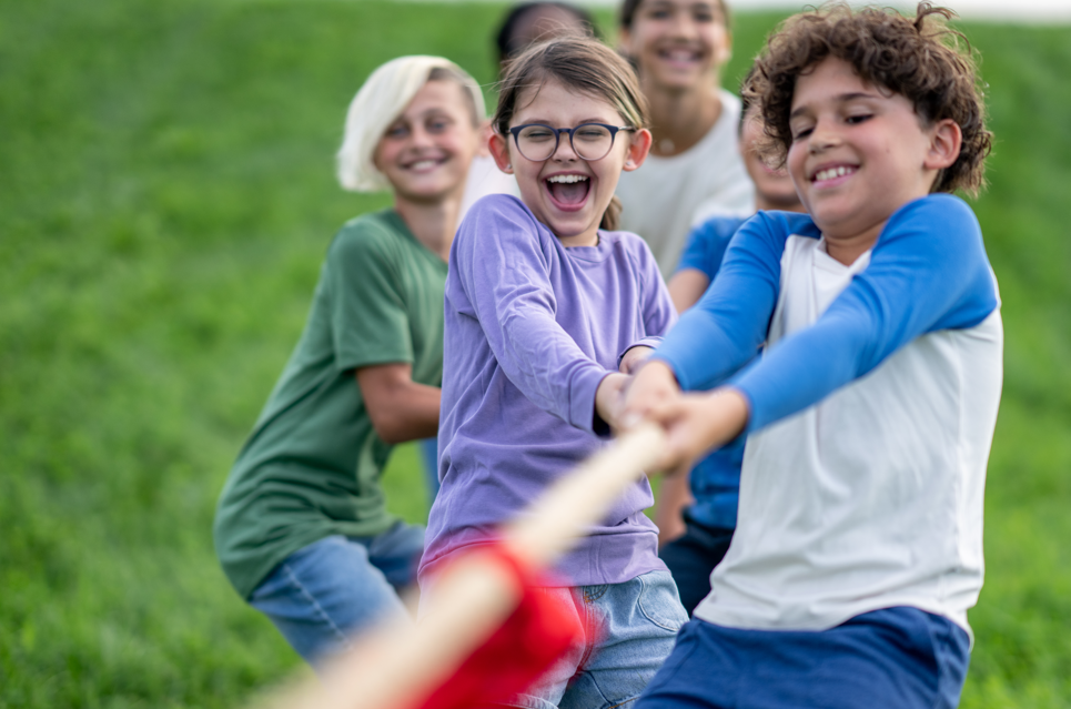 Young kids playing tug-o-war